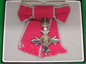 MINT CASED CIVIL M.B.E ON A LADIES BOW RIBBON