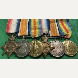 FAMILY GROUP TO BROTHERS IN THE ROYAL NAVY, ONE KIA …