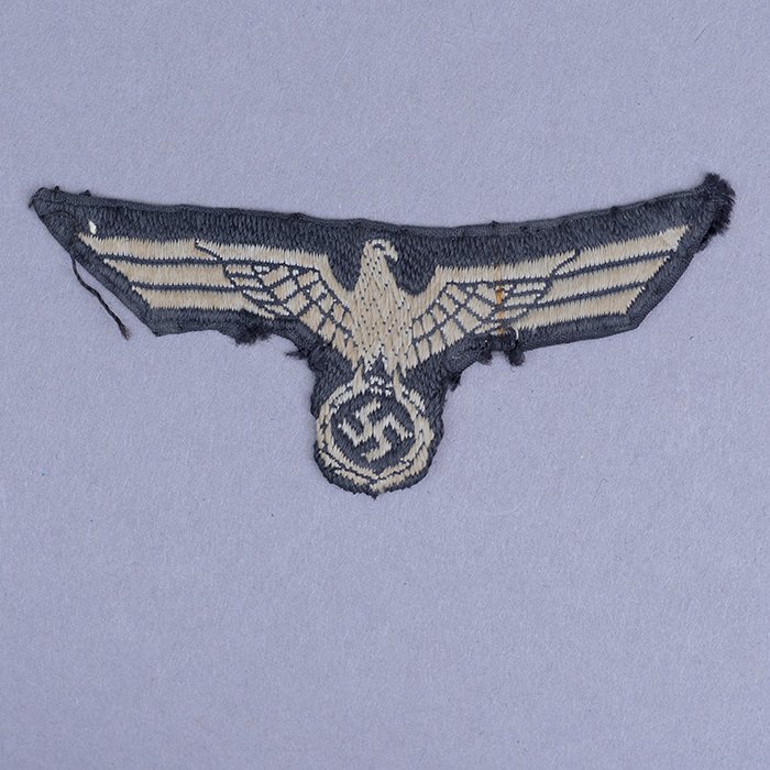 HSS262 Woven national emblem removed from a Heer black Panzer M34 overseas cap by a New Zealand Infantry officer in eastern Cyrenaica — image 4