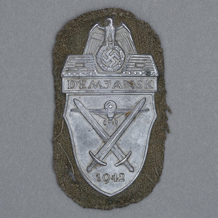 HT21 Uniform removed Demjansk Campaign Shield on field grey cloth backing — image 2