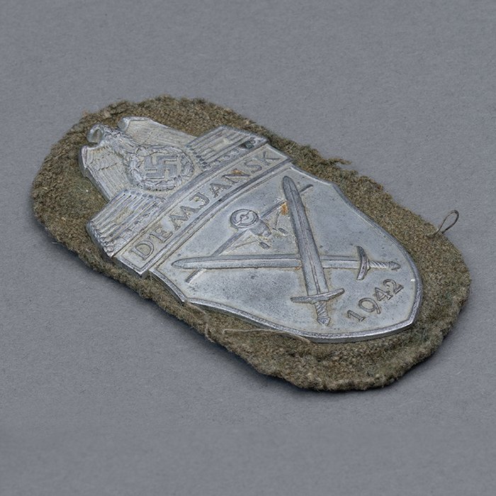 HT21 Uniform removed Demjansk Campaign Shield on field grey cloth backing — image 3