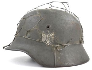 German WH M40 SD Combat Helmet with Battle damage and …
