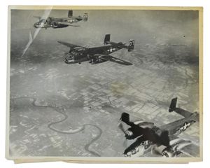 US WW2 Press Photo 'Flak damaged Bomber'