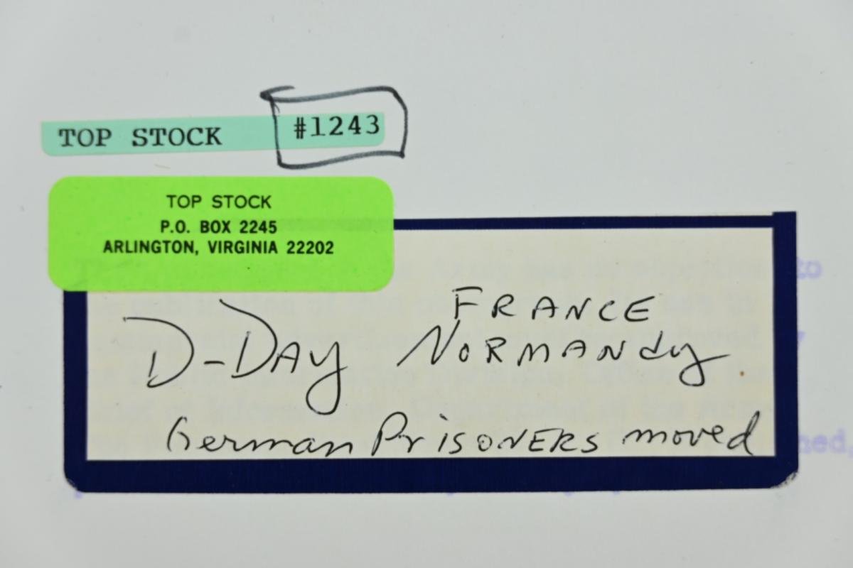 US WW2 Press Photo 'Prisoners of War on the Normandy Beach' — image 6