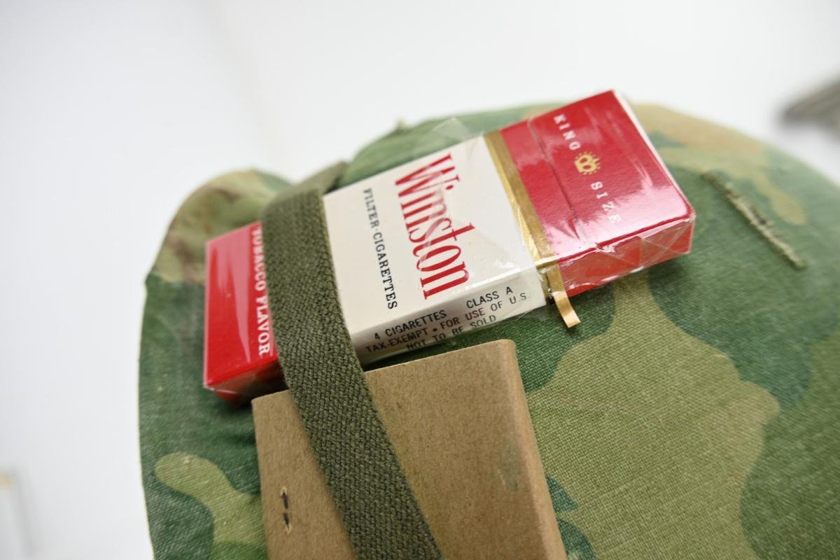 US Vietnam War Infantry helmet with camouflage cover and attached content — image 6