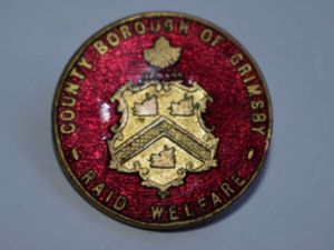 138) Nice original Enamel Badge County Borough of Grimsby Raid …
