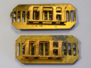 44) Original 11th Hussars Shoulder Title Pair