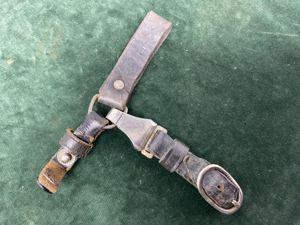 A TRIPLE BLACK LEATHER HANGER FOR A RZM PERIOD SS …