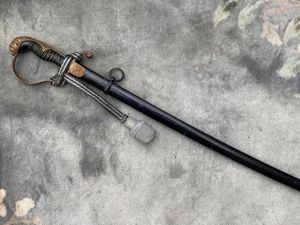 A THIRD REICH PERIOD 'JAWLESS' LIONS HEAD SWORD BY WKC …