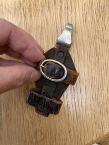 AN EARLY ORIGINAL VERTICAL HANGER FOR A SS '33 DAGGER.