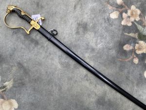 A BEAUTIFUL LIONS HEAD SWORD IN GILDED ALUMINIUM BY CLEM …