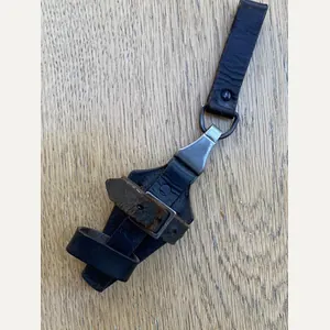 AN ORIGINAL- MARKED BLACK SS VERTICAL DAGGER HANGER.