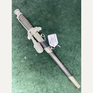 LAND CUSTOMS DAGGER WITH KNOT BY CLEM & JUNG.